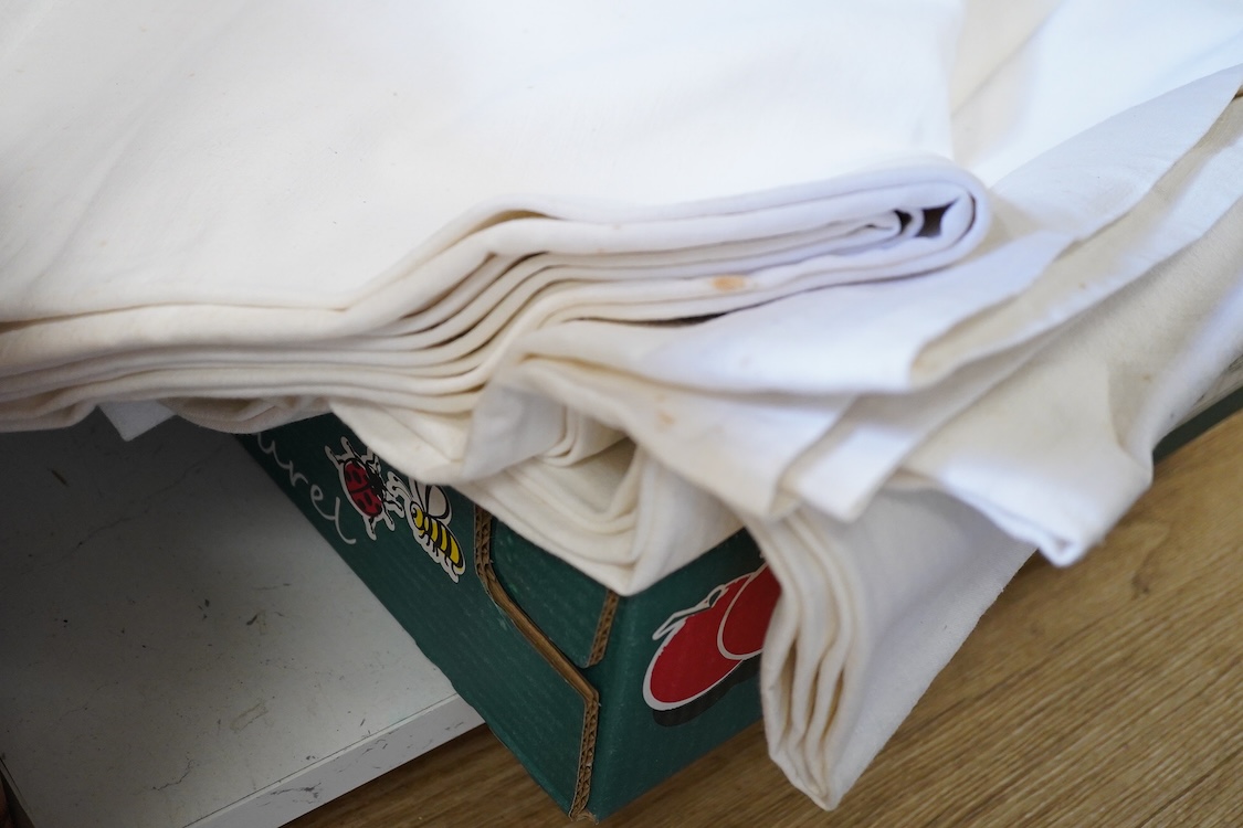 Six French provincial linen sheets each with a red cross stitched monogram to the turn back.